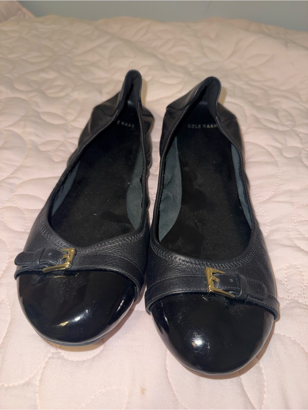 Cole Haan Black Leather Ballet Flats with Patent Cap Toe and Gold Buckle